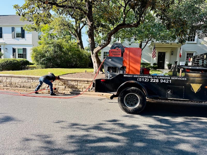 Licensed plumber performing sewer line inspection