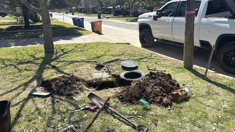 Licensed plumber performing sewer line inspection