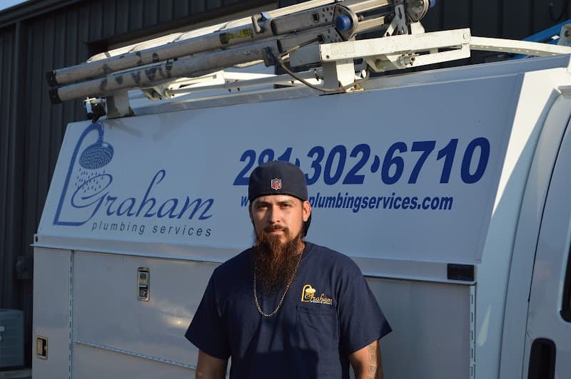 Licensed plumber performing sewer line inspection