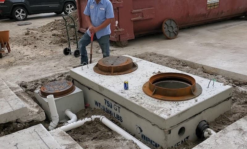 Licensed plumber performing sewer line inspection