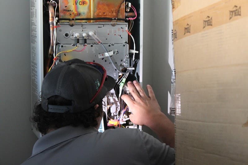 Licensed plumber performing sewer line inspection