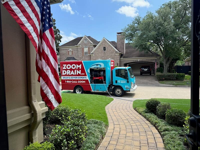 Licensed plumber performing sewer line inspection